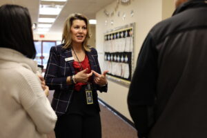 Martha Wiley, Director of Admissions, tours school with families.